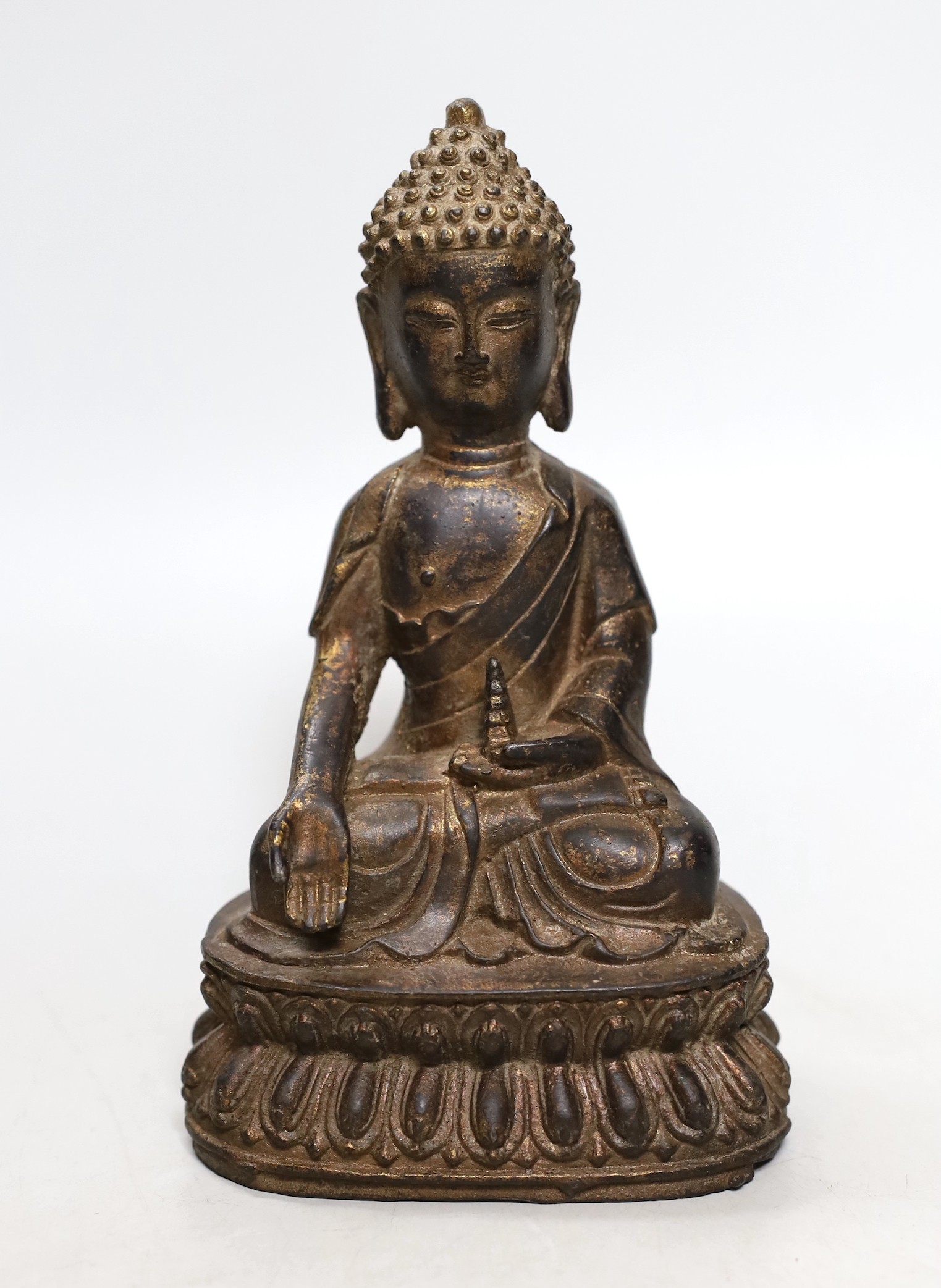 A Chinese gilt iron seated figure of Buddha, 19cm